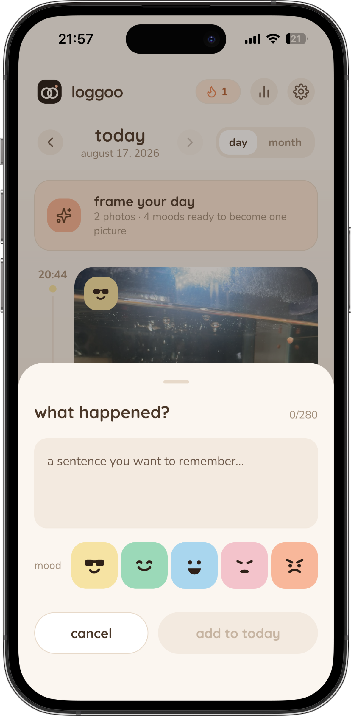 loggoo camera screen with a caption typed on the photo and the mood row below